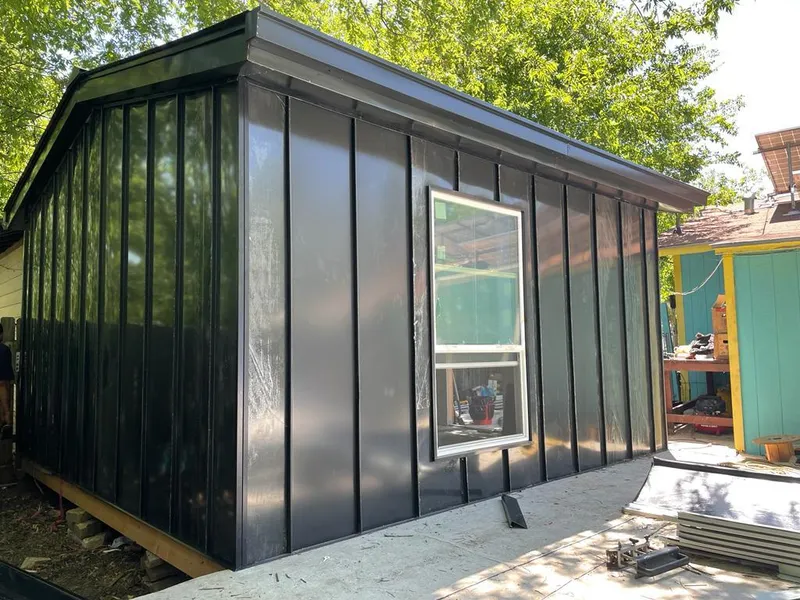 Black standing seam metal wall panels for Roof Inspection in West Lafayette